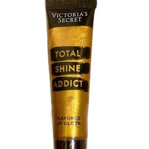 Victoria’s Secret Total Shine Addict Flavored Lip gloss in shade Gold Crush